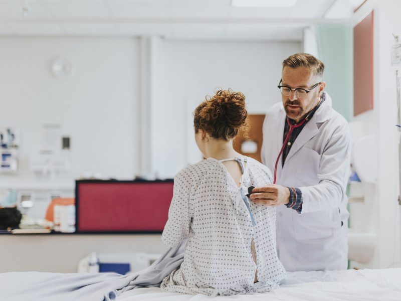 Physician doing a medical checkup on a patient