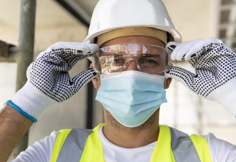 worker-wearing-safety-glasses-on-construction-site